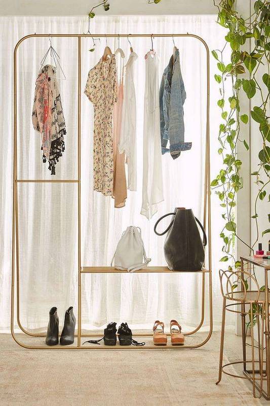 35-spare-bedrooms-that-turned-into-dream-closets-turn-room-into-walk-in-closet-urban-outfitters-clothing-rack-572faeb31f1859cc5a971f30-w620_h800